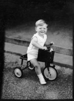 David Wallace Macky (2 yr) on a tricycle