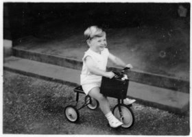David Wallace Macky (2 yr) on a tricycle