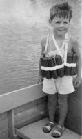 DWM in WAM's boat wearing life vest, August 1940