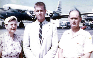 Mary MacLean Macky, David Wallace Macky, and Wallace Armstrong Macky at airport, PAA Clipper Andrew Jackson in background