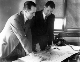 Wallace Armstrong Macky (right) with meterology charts