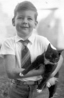 David Wallace Macky (6 yr) holding cat