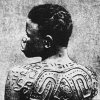 The ancient cross, known as the swastika, scarred upon this woman's back...